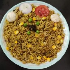A picture of Mushroom and peas biryani.