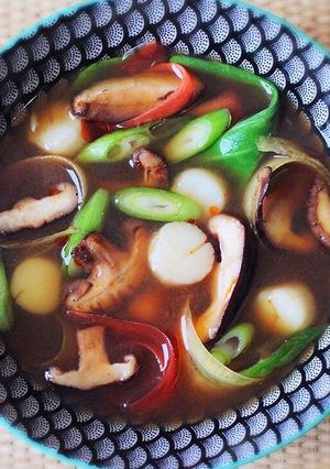 A picture of Shiitake Dashi with quick cooked scallops.