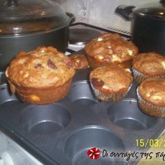 A picture of Muffins with feta cheese and olives.