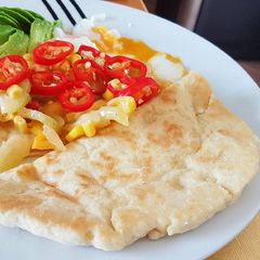 A picture of Flat Bread with Poach Egg.
