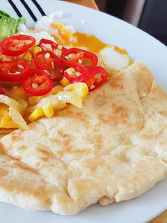 A picture of Flat Bread with Poach Egg.