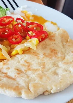 A picture of Flat Bread with Poach Egg.
