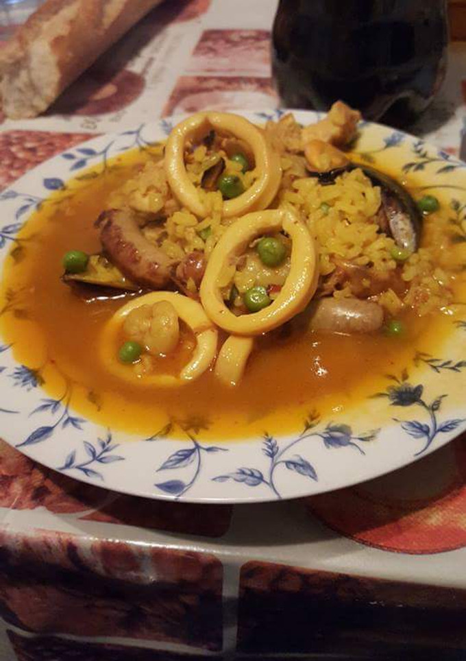Una foto de Arroz caldoso con calamares