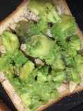 Avocado toast with slice almonds and cinnamon