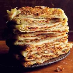 A picture of Mhadjeb (stuffed flatbread) (Algeria).