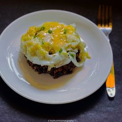 A picture of Black Fried Rice with minced garlic.