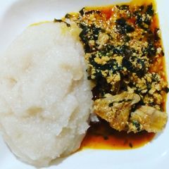 Egusi soup and eba A picture of Egusi soup and eba.