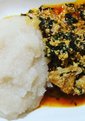 A picture of Egusi soup and eba.