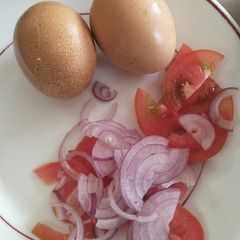 A picture of Boil eggs with kachumbari.