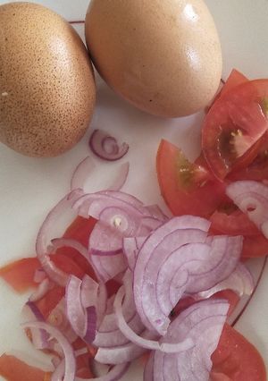 A picture of Boil eggs with kachumbari.