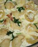 Galets gratinados con rúcula y bacon