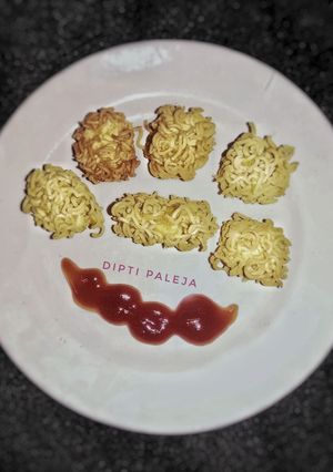 A picture of Noodles Coated Cheese Fritters.