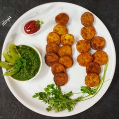 A picture of Ripe banana fritters with kiwi dip.