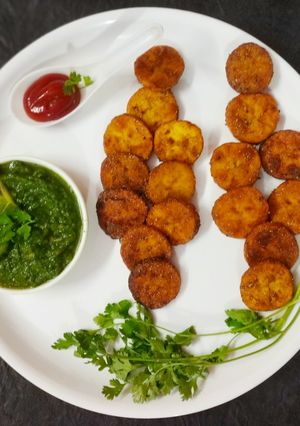A picture of Ripe banana fritters with kiwi dip.
