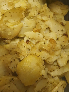 Una foto de Patatas al horno con cebolla