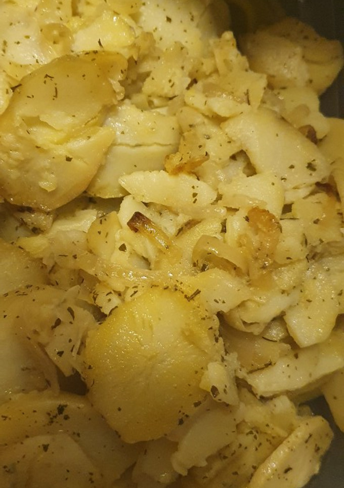 Una foto de Patatas al horno con cebolla