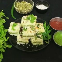 A picture of Suji Sprouts Sandwich Dhokla.