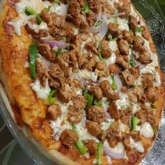 Chicken fajita spicy tawa pizza A picture of Chicken fajita spicy tawa pizza.