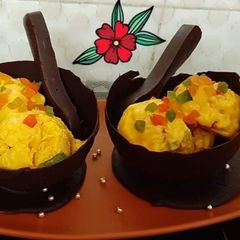 A picture of Mango Tutti Frutti Ice Cream In Chocolate Bowls.