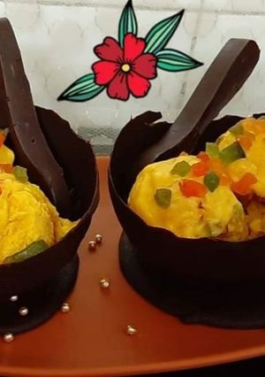 A picture of Mango Tutti Frutti Ice Cream In Chocolate Bowls.