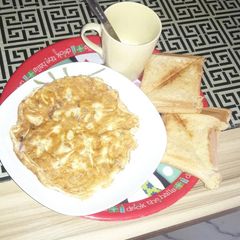 Plain fried egg and toasted bread A picture of Plain fried egg and toasted bread.