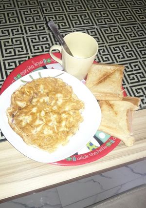 A picture of Plain fried egg and toasted bread.