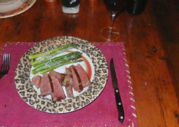 Sous vide aged prime strip steak with parmesan Asparagus