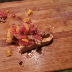 A picture of Sausage scramble on Italian bread.