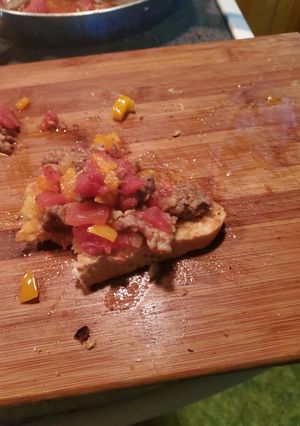 A picture of Sausage scramble on Italian bread.