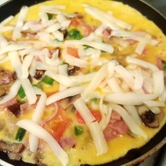 A picture of Ham,cheese and mushroom stuffed omelette.