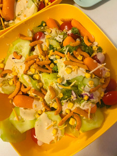 A picture of Fresh salad with dressing.