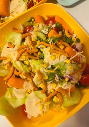 A picture of Fresh salad with dressing.