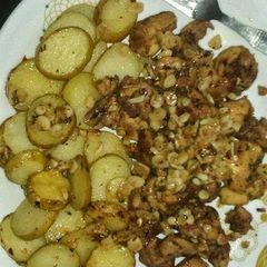 A picture of Baked chicken and potato.