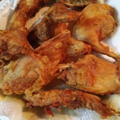 A picture of Fried Rabbit in a cast iron skillet.