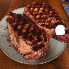 A picture of 3 inch thick ribeye steak on BBQ.
