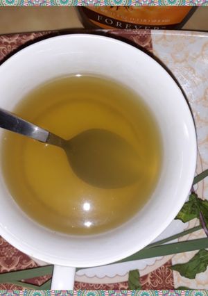 A picture of Lemon grass and mint leaves tea.