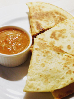 A picture of Chicken Quesadillas with salsa.