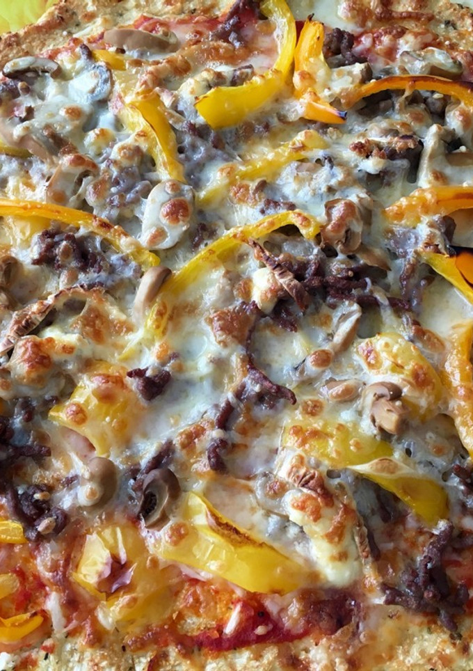 Una foto de Pizza con masa de coliflor