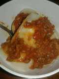Agnolottis de ricota, jamón y queso con ragout