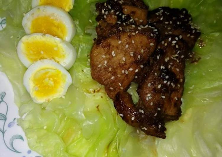All spices chicken with boiled egg and cabbage