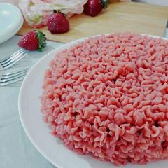 A picture of Eggless Chocolate cake with Strawberry Buttercream frosting.