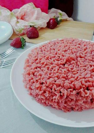 A picture of Eggless Chocolate cake with Strawberry Buttercream frosting.