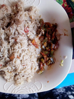 A picture of Vegetable pilau served with french beans.