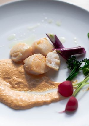 A picture of Sautéed scallops with roe sauce.