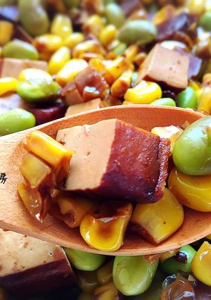 A picture of Savory Braised Tofu with Edamame and Corn.