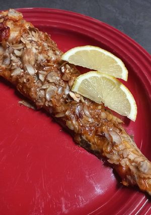A picture of Hake with Pesto and mixed Nut flakes.
