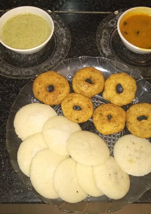 A picture of Idli vada with coconut chutney and sambhar.