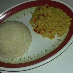 A picture of White rice with awara and egg sauce.