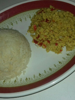 A picture of White rice with awara and egg sauce.