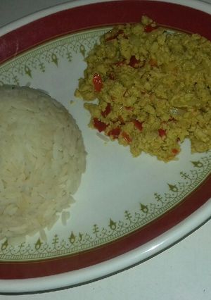 A picture of White rice with awara and egg sauce.